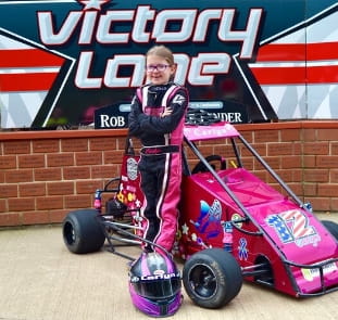 MOR Construction proudly supporting the Singleton Race Team, featuring a young racer in Victory Lane